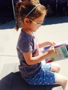 Enjoying her book in the sunshine